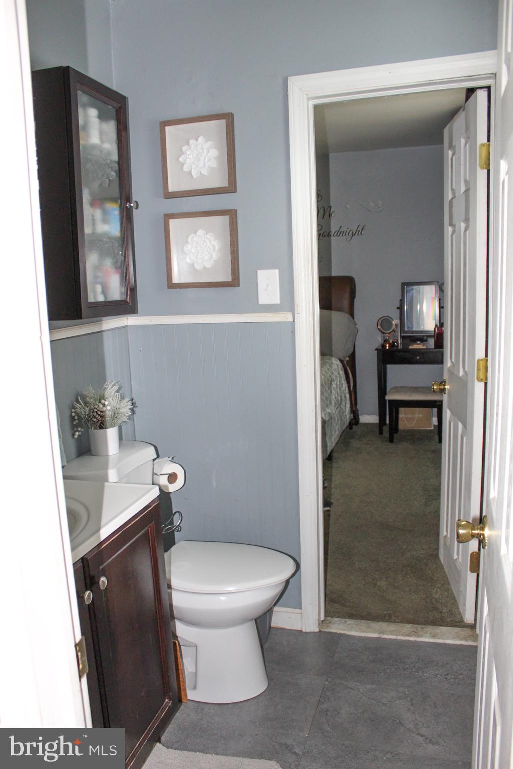 30 Sharp Avenue Bridgeton, NJ 08302 - Photo 12 of 18 a bathroom with a toilet a sink and mirror