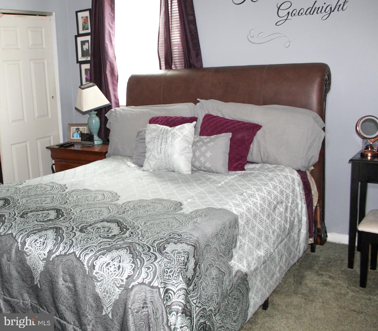 30 Sharp Avenue Bridgeton, NJ 08302 - Photo 15 of 18 a bedroom with a bed and lamp