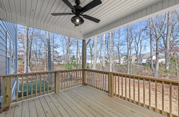a view of a balcony with wooden floor