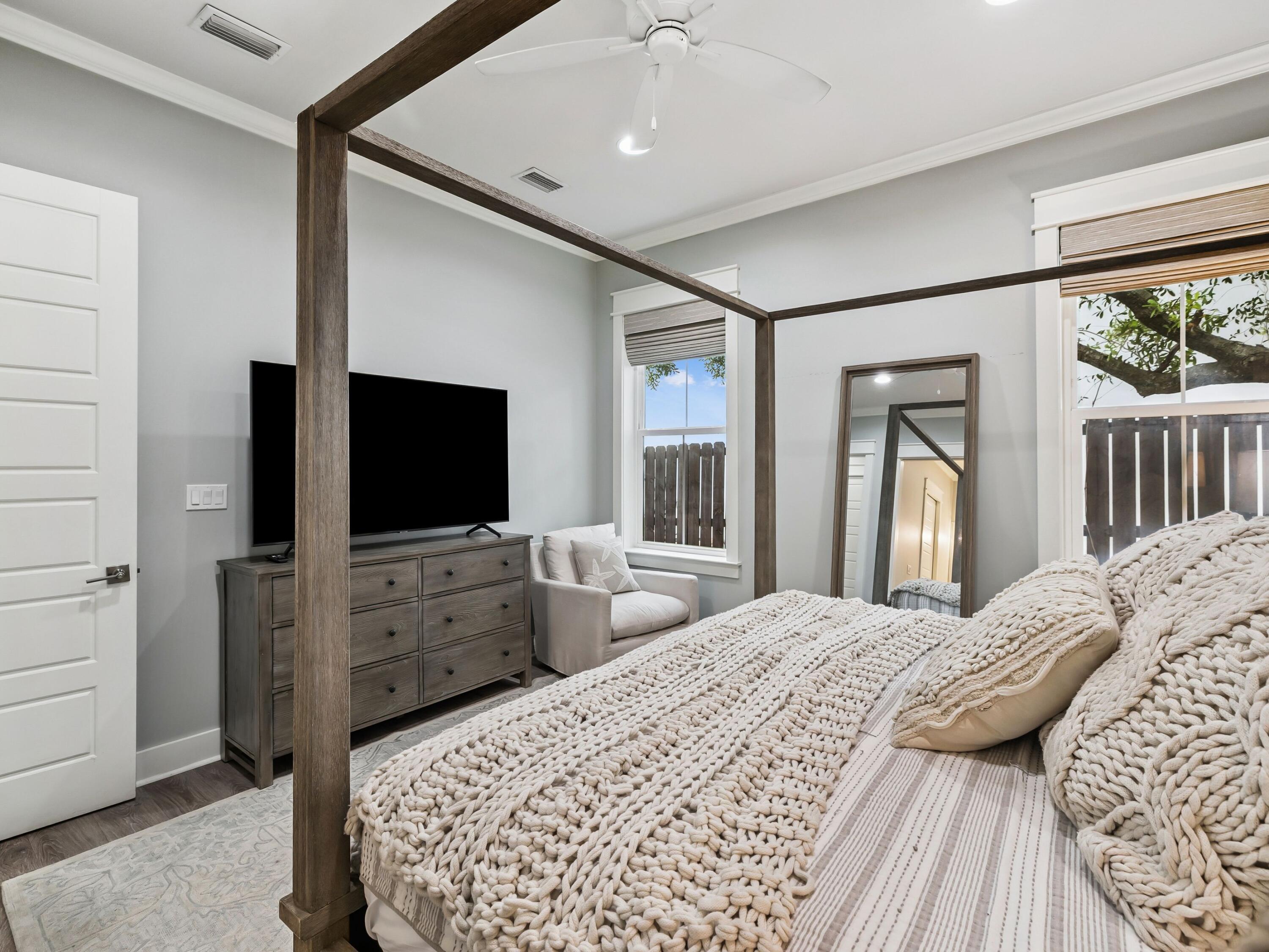 29 Tidewater Ct Inlet Beach Inlet Beach, FL 32461 - Photo 11 of 25 a bedroom with a bed and a flat screen tv