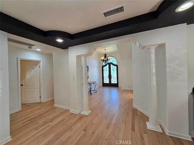a view of hallway with wooden floor