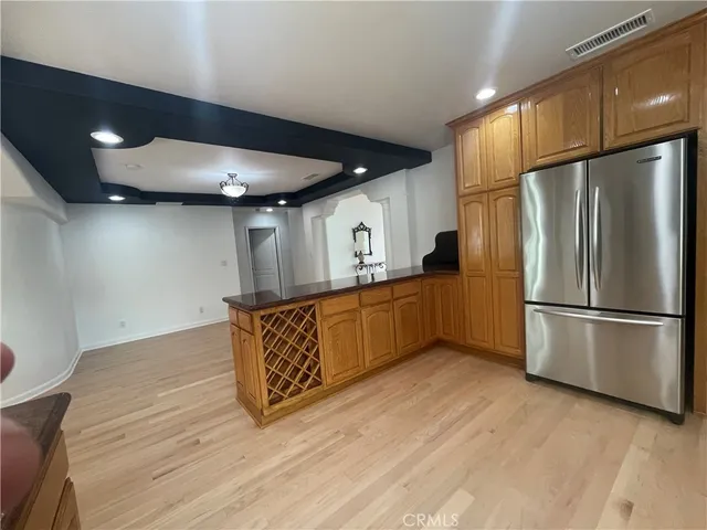 a kitchen with stainless steel appliances a refrigerator and a sink