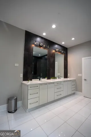 a large bathroom with a large tub and sink