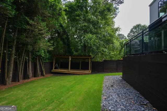 a view of a backyard with a small cabin