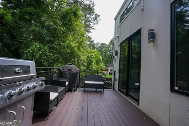 a sitting area with furniture and wooden floor