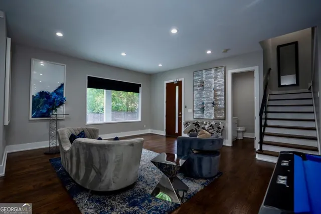a living room with furniture and a large window