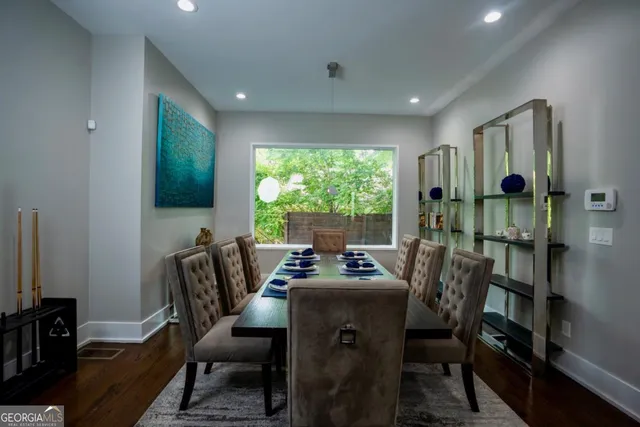 a view of a workspace with furniture and a flat screen tv