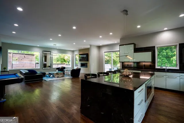 a kitchen with kitchen island granite countertop lots of counter top space