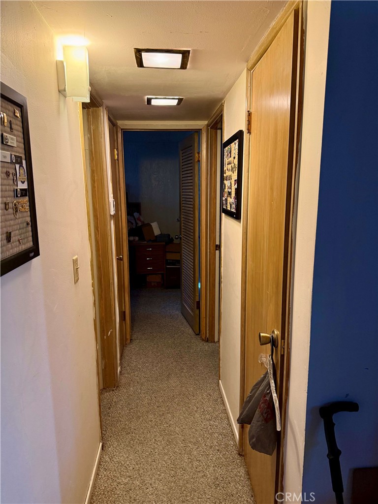 31776 Panorama Road Running Springs, CA 92382 - Photo 11 of 11 a view of a hallway with closet and a livingroom view