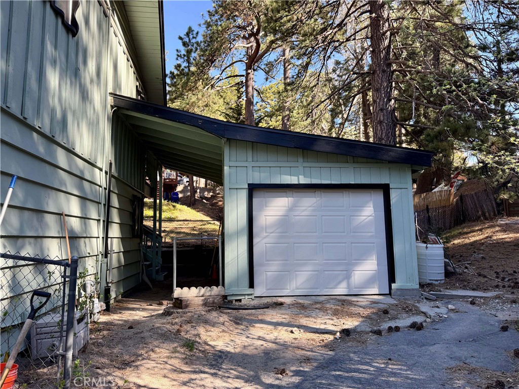 31776 Panorama Road Running Springs, CA 92382 - Photo 2 of 11 a view of a house with large trees and a barn