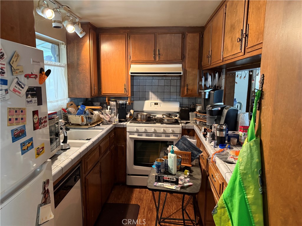 31776 Panorama Road Running Springs, CA 92382 - Photo 7 of 11 a kitchen with a sink stove and cabinets