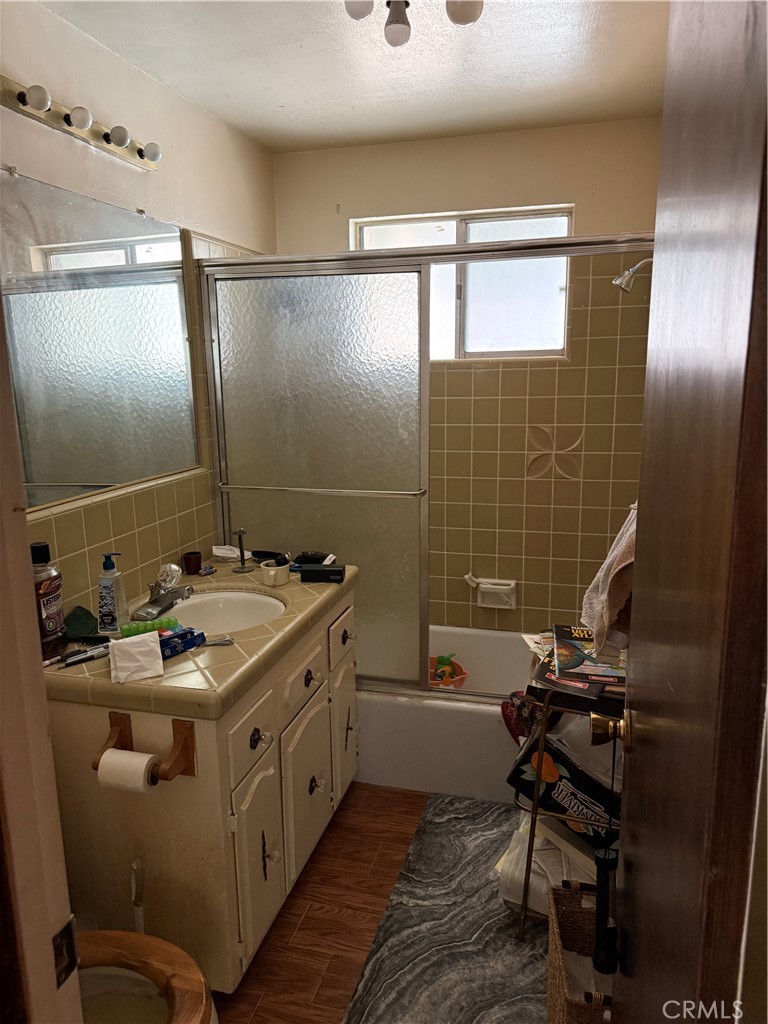 31776 Panorama Road Running Springs, CA 92382 - Photo 9 of 11 a bathroom with a double vanity sink a toilet and mirror