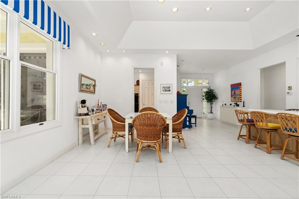736 Ashburton Drive Naples, FL 34110 - Photo 11 of 37 a living room with furniture and a window