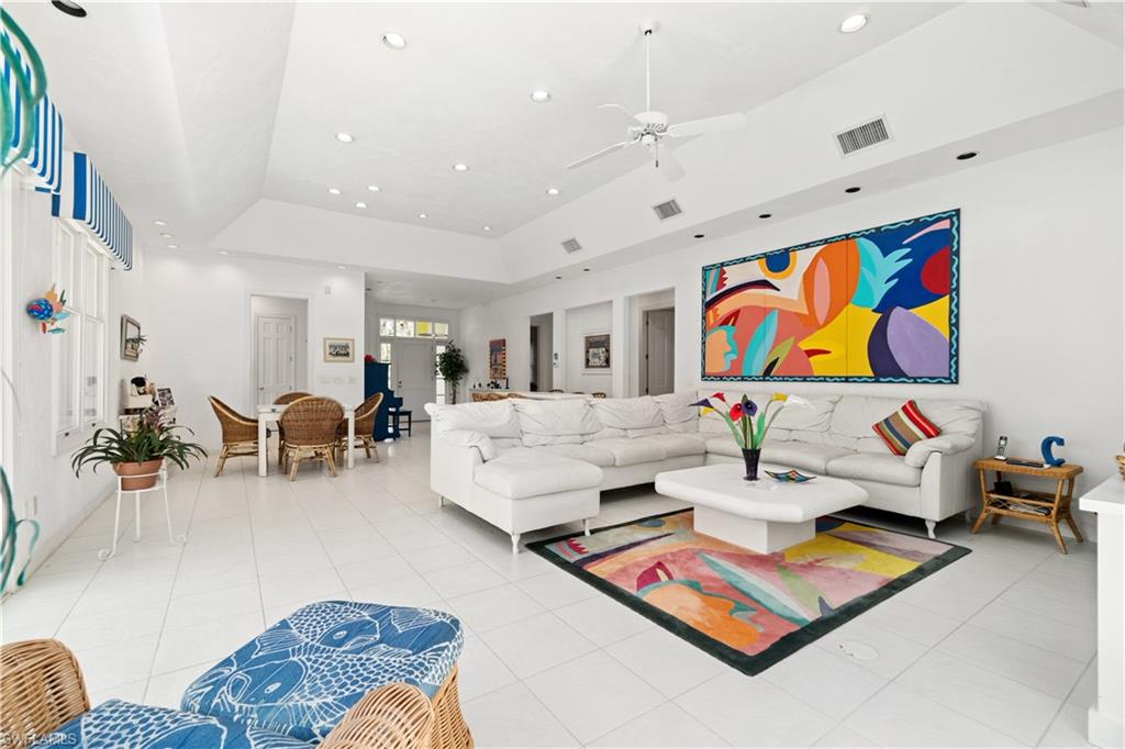736 Ashburton Drive Naples, FL 34110 - Photo 13 of 37 a living room with furniture kitchen view and a table