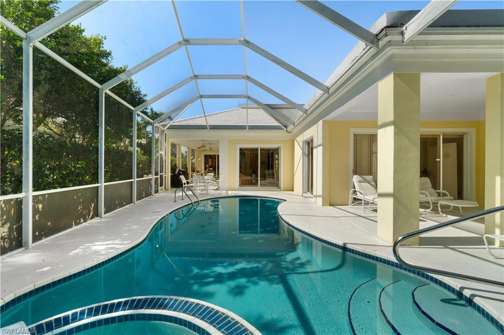 736 Ashburton Drive Naples, FL 34110 - Photo 15 of 37 a view of swimming pool with seating area and furniture