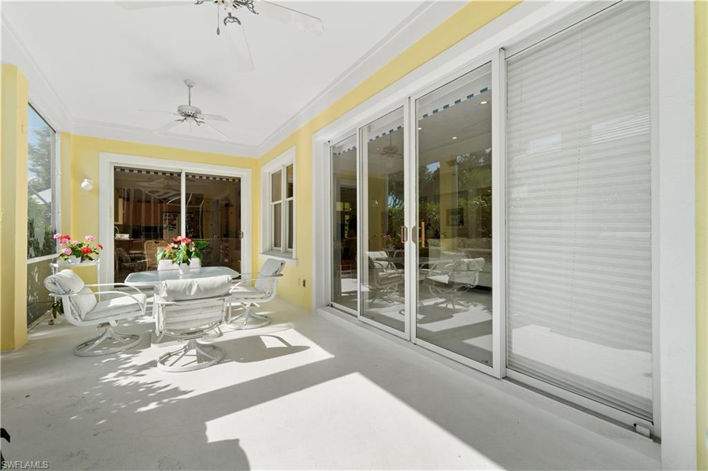 736 Ashburton Drive Naples, FL 34110 - Photo 24 of 37 a view of a very nice looking living room with a large window