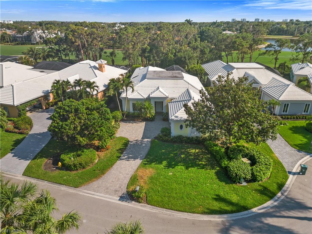 736 Ashburton Drive Naples, FL 34110 - Photo 26 of 37 an aerial view of a house with a garden