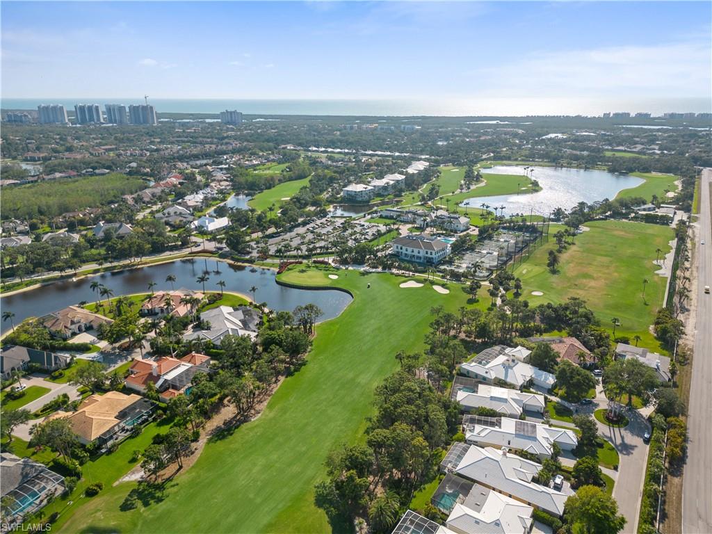 736 Ashburton Drive Naples, FL 34110 - Photo 27 of 37 an aerial view of residential houses with outdoor space