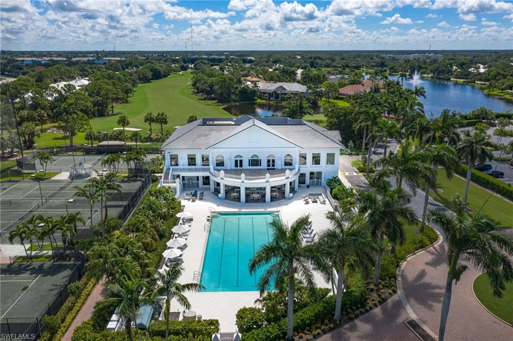 736 Ashburton Drive Naples, FL 34110 - Photo 30 of 37 an aerial view of a house with a garden and lake view