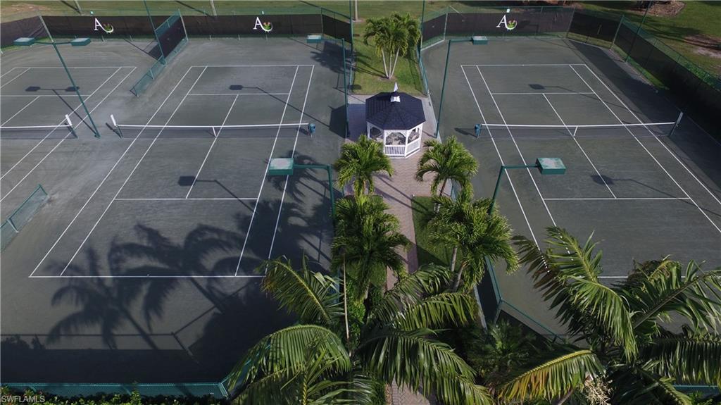 736 Ashburton Drive Naples, FL 34110 - Photo 31 of 37 an aerial view of residential houses with outdoor space