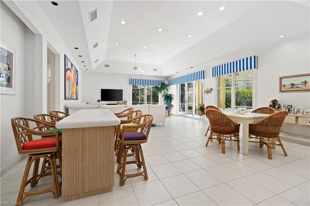 736 Ashburton Drive Naples, FL 34110 - Photo 9 of 37 a view of a dining room with furniture
