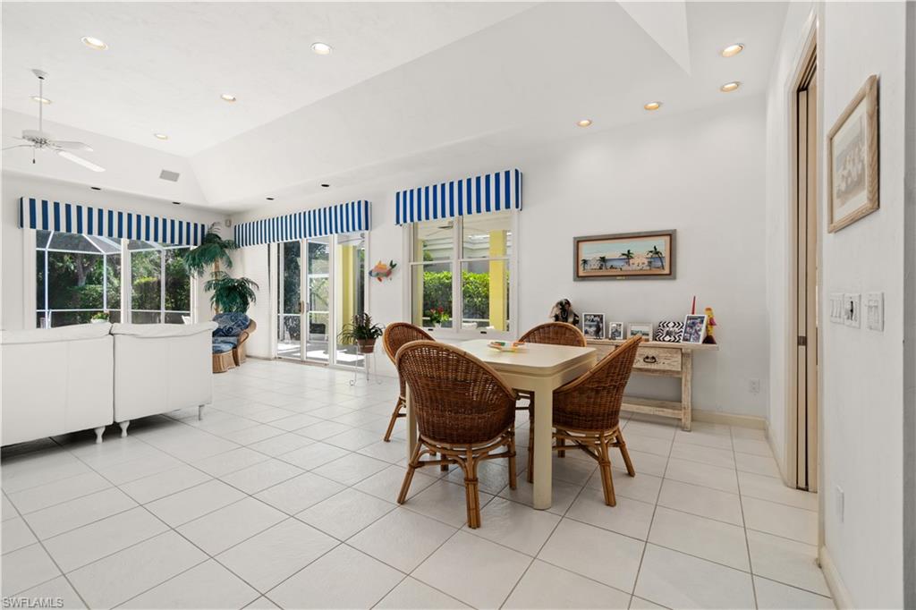 736 Ashburton Drive Naples, FL 34110 - Photo 10 of 37 a view of a dining room with furniture window and outside view