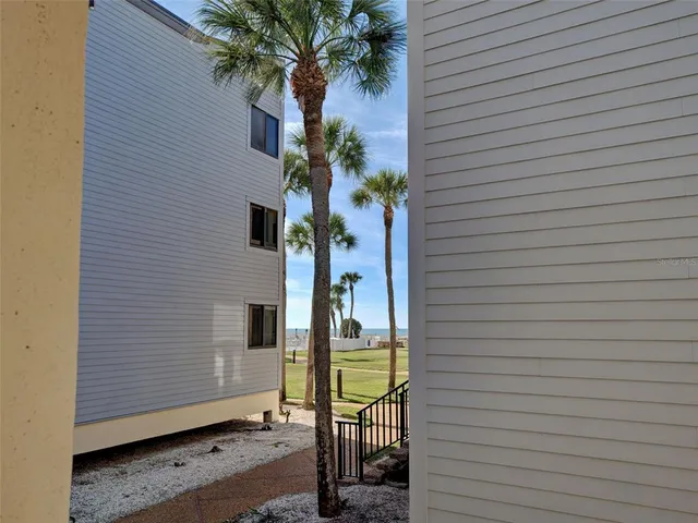 a kitchen with cabinets and stainless steel appliances