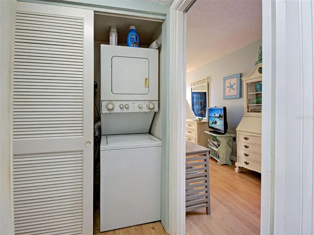 a bed room with a bed and a television