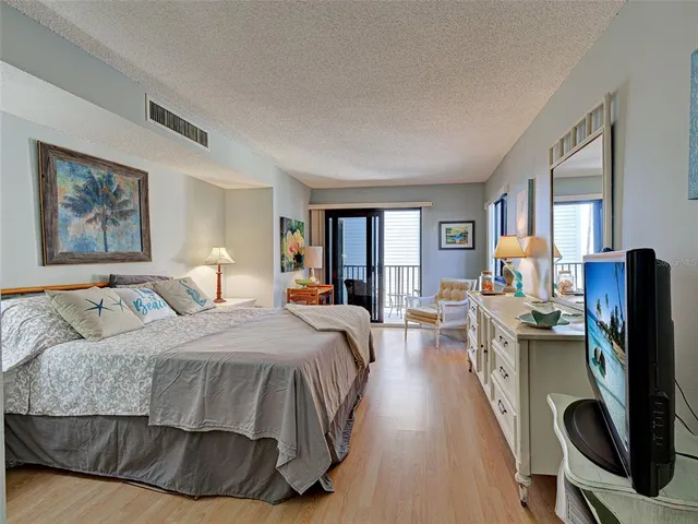 a bedroom with a bed and furniture