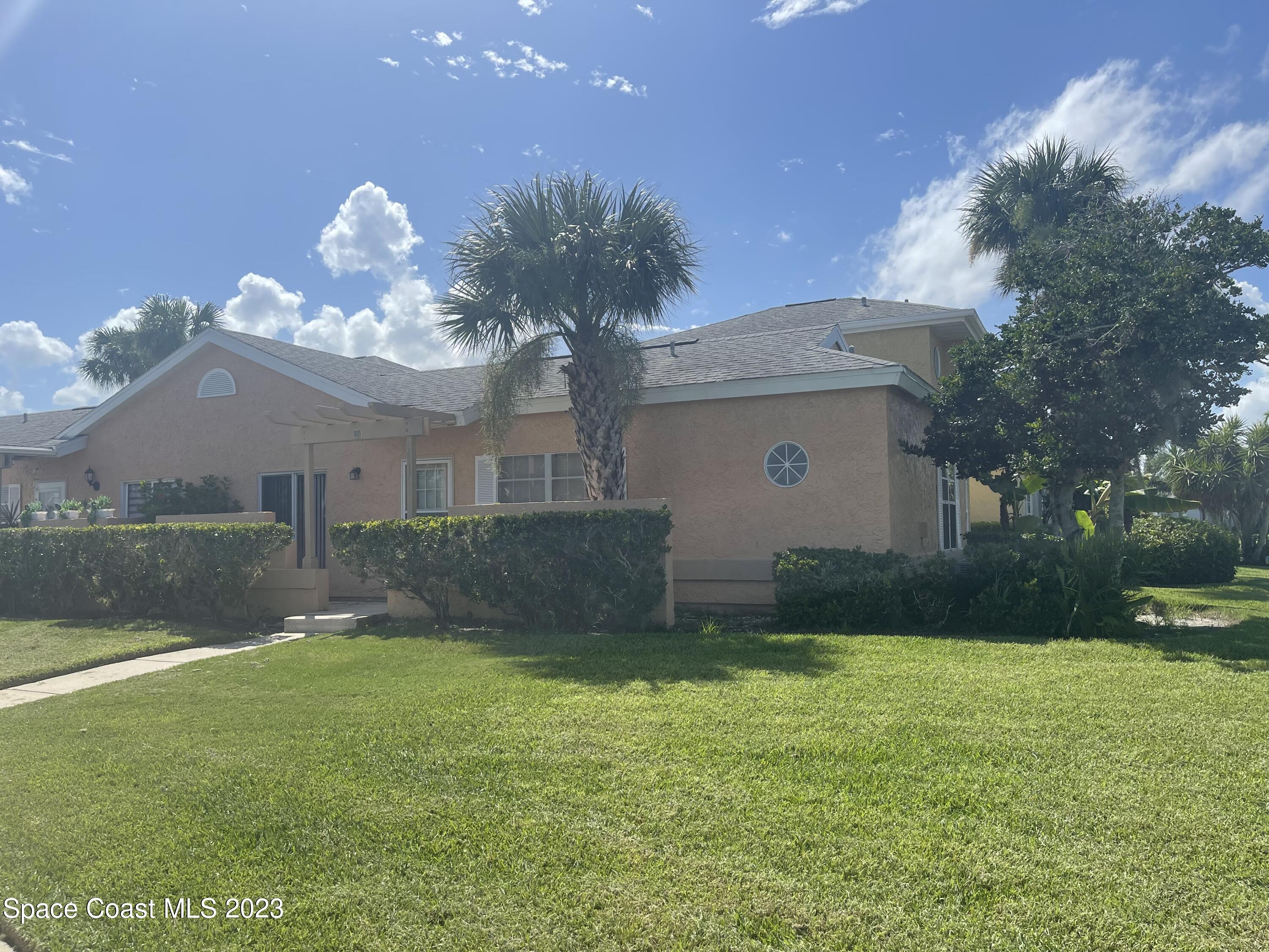 a front view of house with garden