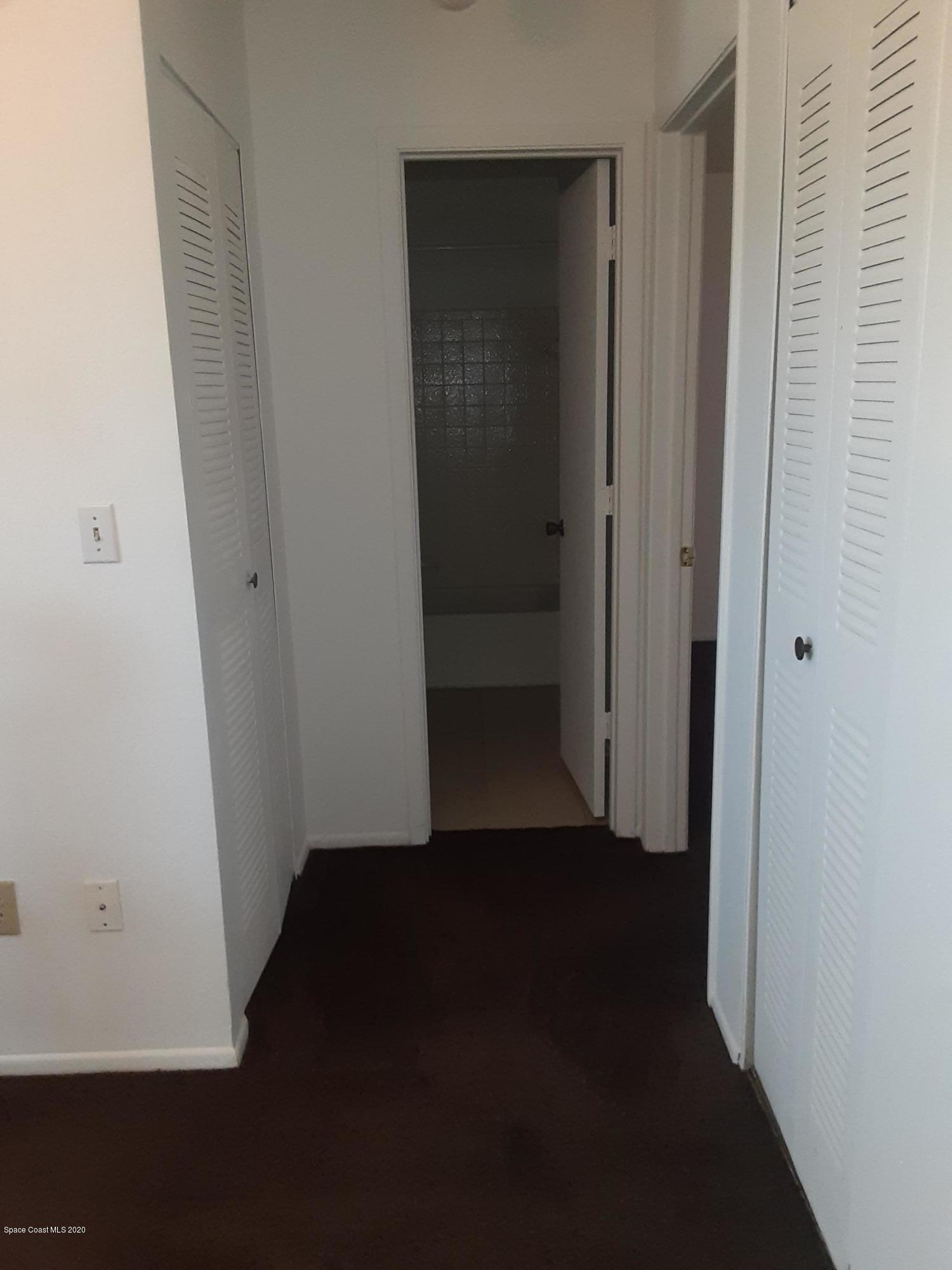 1485 Malibu Circle Northeast, Unit 101 Palm Bay, FL 32905 - Photo 6 of 9 a view of a hallway