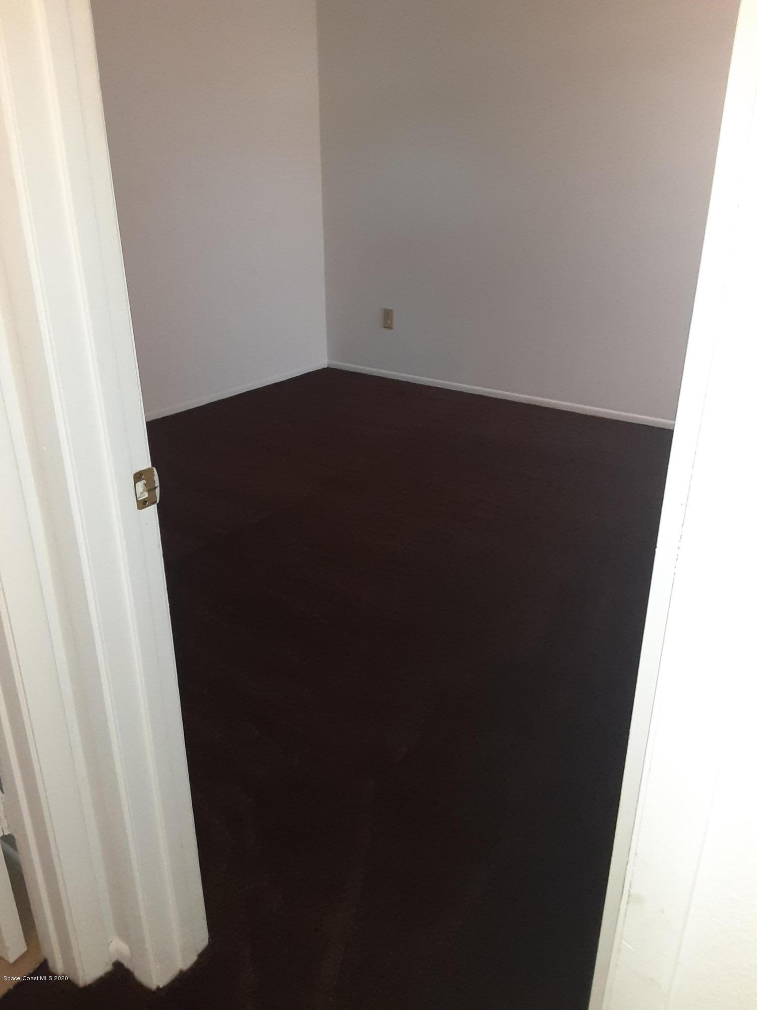 1485 Malibu Circle Northeast, Unit 101 Palm Bay, FL 32905 - Photo 7 of 9 a close view of cupboard