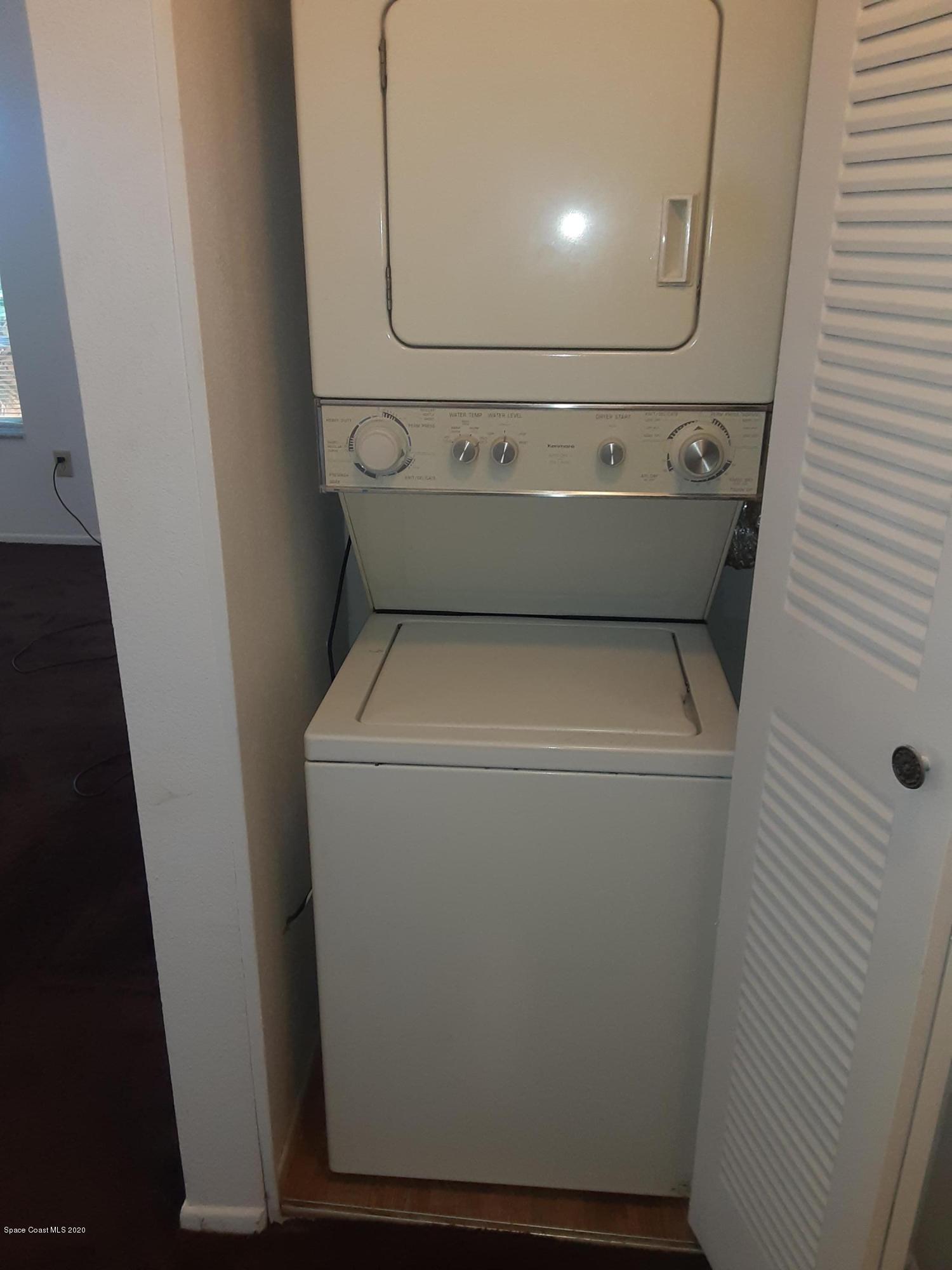 1485 Malibu Circle Northeast, Unit 101 Palm Bay, FL 32905 - Photo 9 of 9 a bathroom with a sink and a mirror