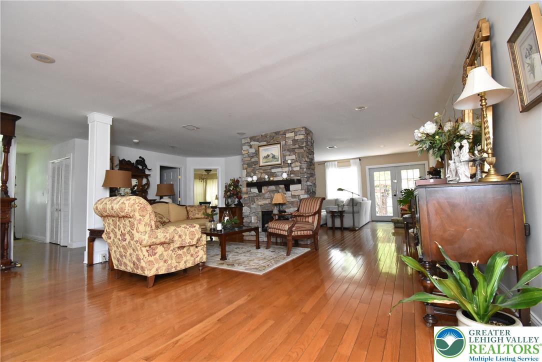 424 Grape Street Whitehall, PA 18052 - Photo 28 of 56 This expansive living area features lustrous hardwood flooring and a beautiful stone fireplace.