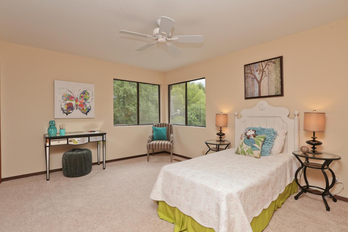 13987 Pike Road Saratoga, CA 95070 - Photo 12 of 28 a bedroom with a bed painting on wall and a large window