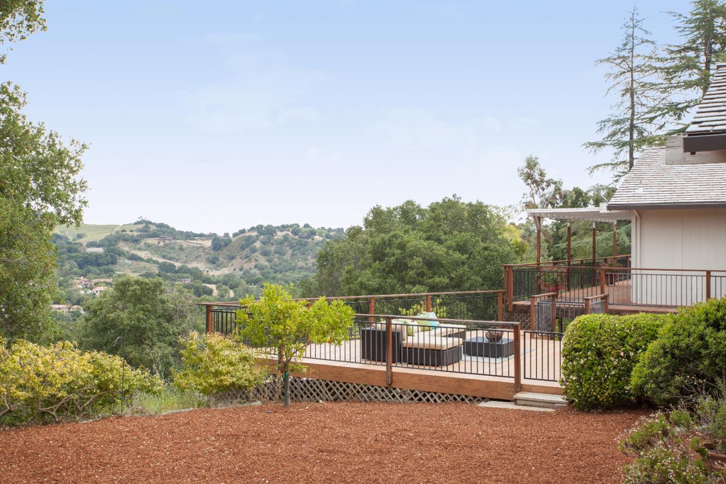13987 Pike Road Saratoga, CA 95070 - Photo 22 of 28 a view of a terrace with a bench