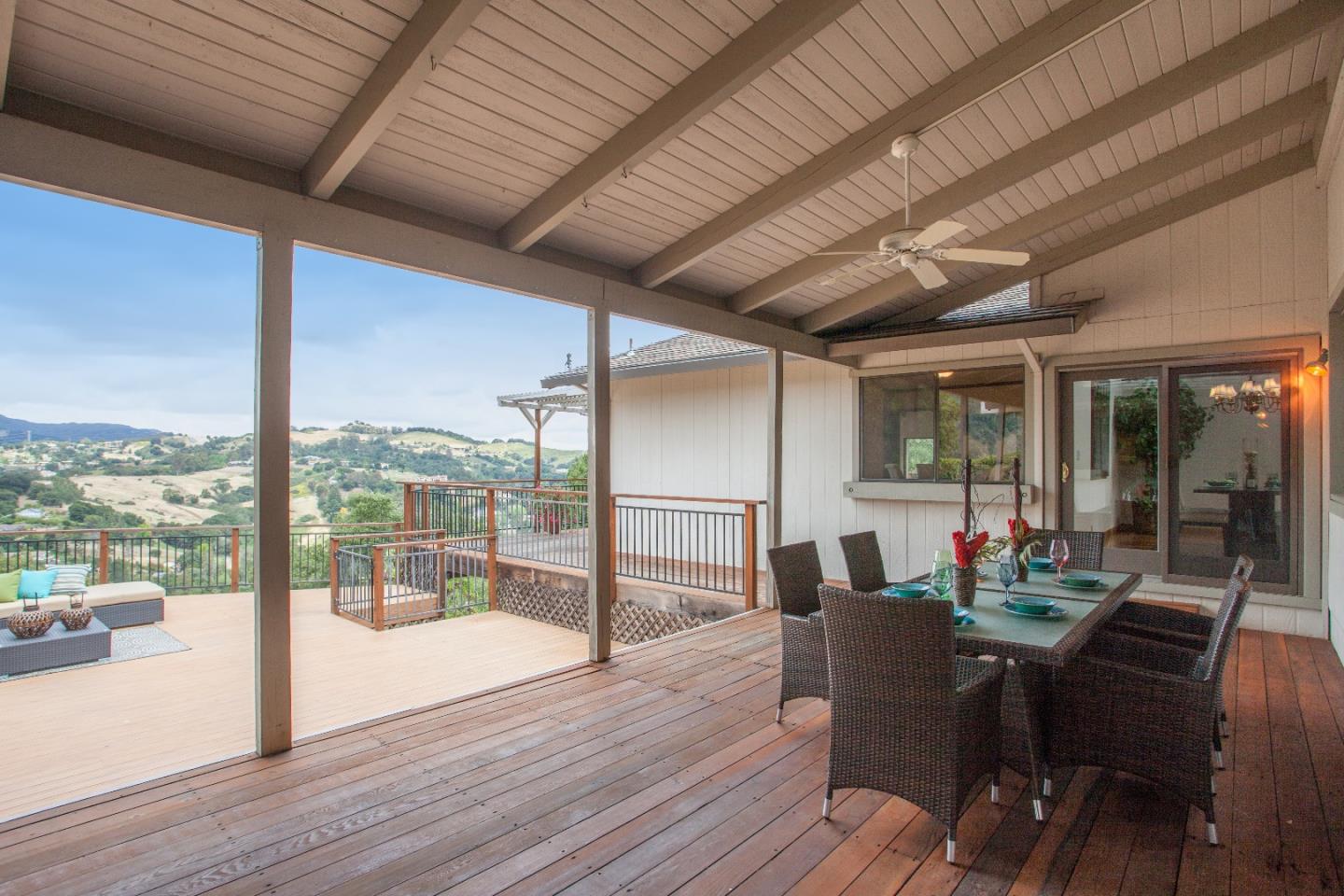 13987 Pike Road Saratoga, CA 95070 - Photo 23 of 28 a dining room with furniture wooden floor and a floor to ceiling window
