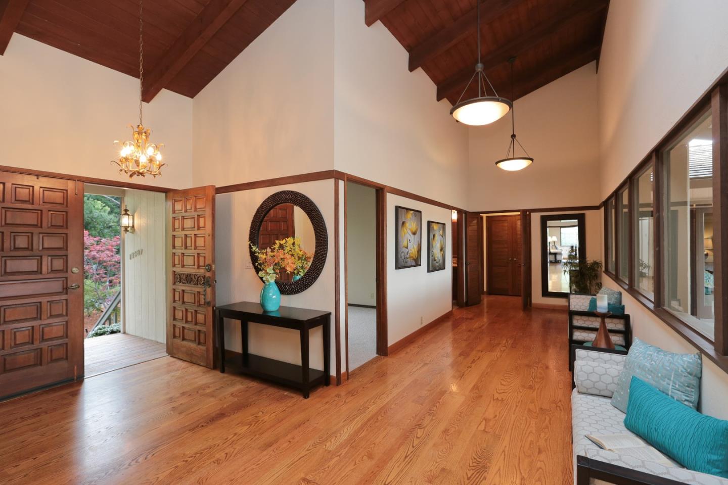 13987 Pike Road Saratoga, CA 95070 - Photo 4 of 28 a view of a livingroom with furniture wooden floor fan and windows