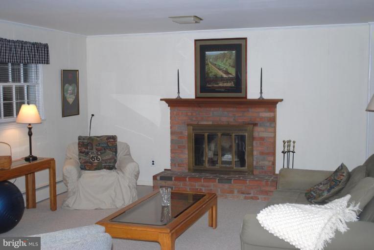 6721 Bulkley Road Lorton, VA 22079 - Photo 12 of 14 Raised hearth wood burning fireplace