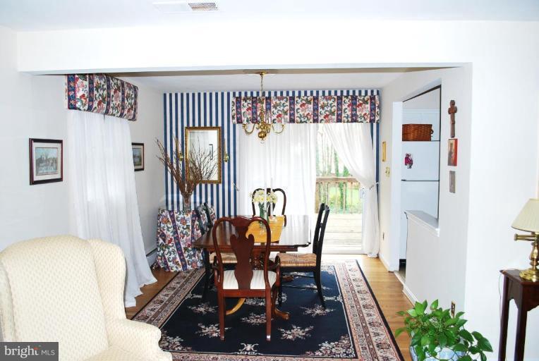 6721 Bulkley Road Lorton, VA 22079 - Photo 3 of 14 Formal dining room with sliding door to deck