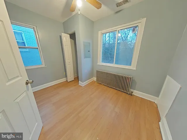 a view of an empty room with a window