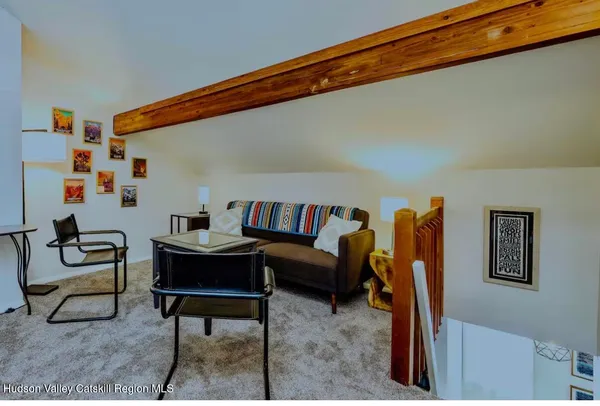 a living room with furniture and a rug