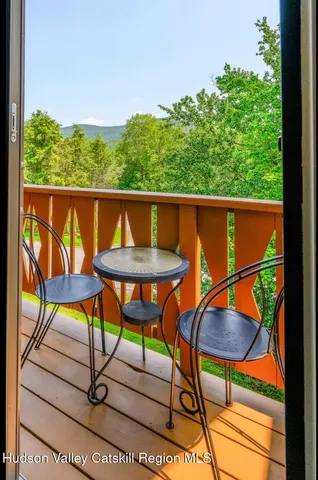 a view of chairs and table in a balcony