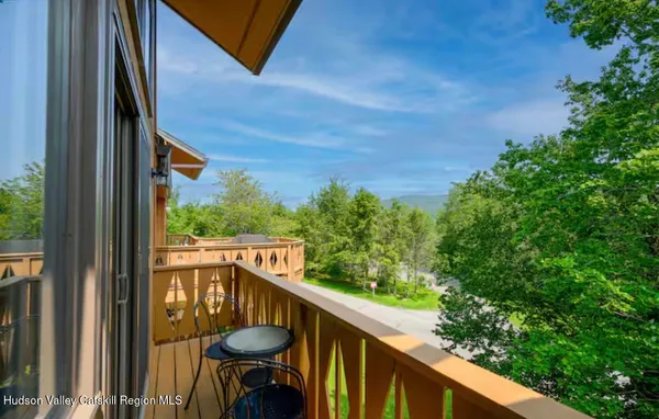 a view of balcony with furniture