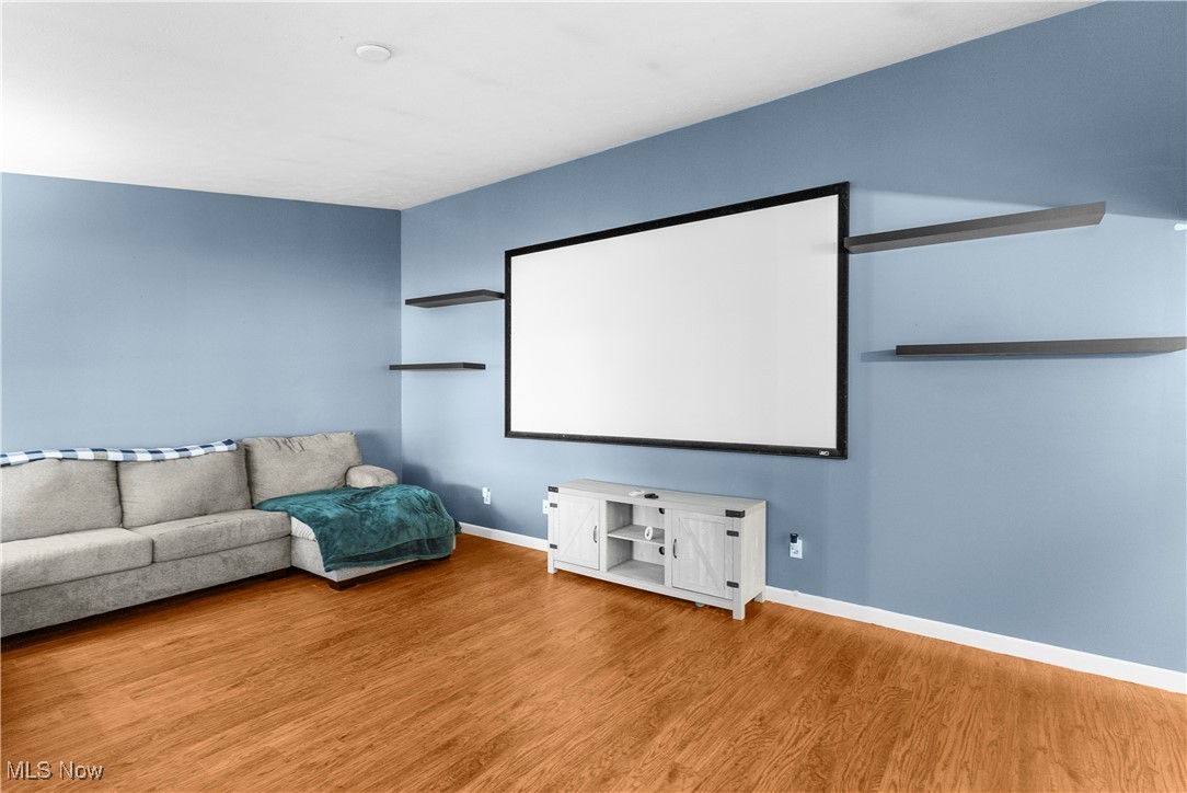 4075 Kirk Road Austintown, OH 44511 - Photo 13 of 40 Home theater room with baseboards and wood finished floors