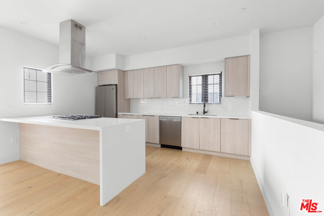 736 Parkman Avenue Los Angeles, CA 90026 - Photo 13 of 34 a kitchen with a sink cabinets and window