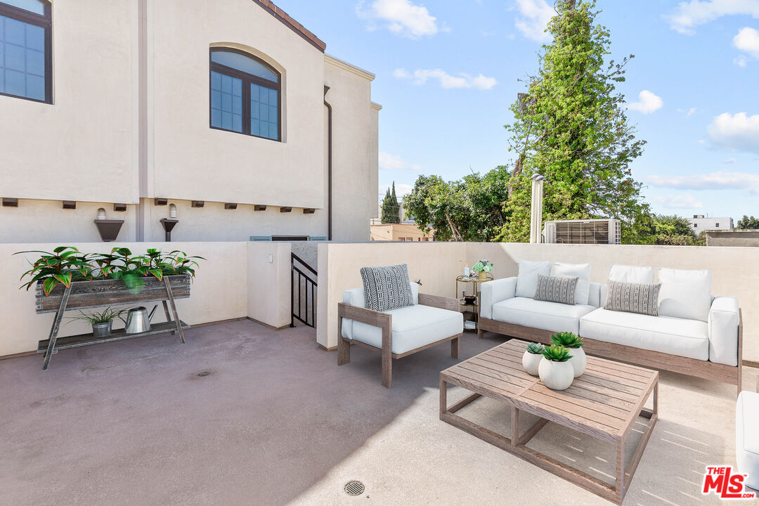 736 Parkman Avenue Los Angeles, CA 90026 - Photo 33 of 34 a living room with furniture and a potted plant