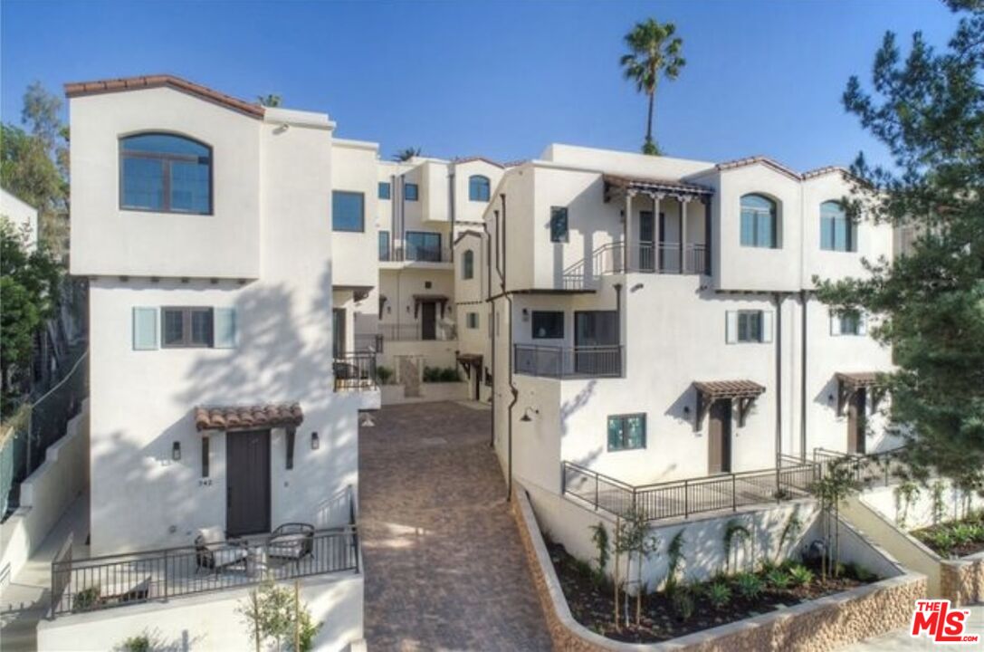 736 Parkman Avenue Los Angeles, CA 90026 - Photo 34 of 34 a view of a white building with many windows