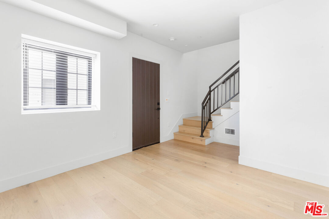 736 Parkman Avenue Los Angeles, CA 90026 - Photo 5 of 34 a view of an empty room with stairs