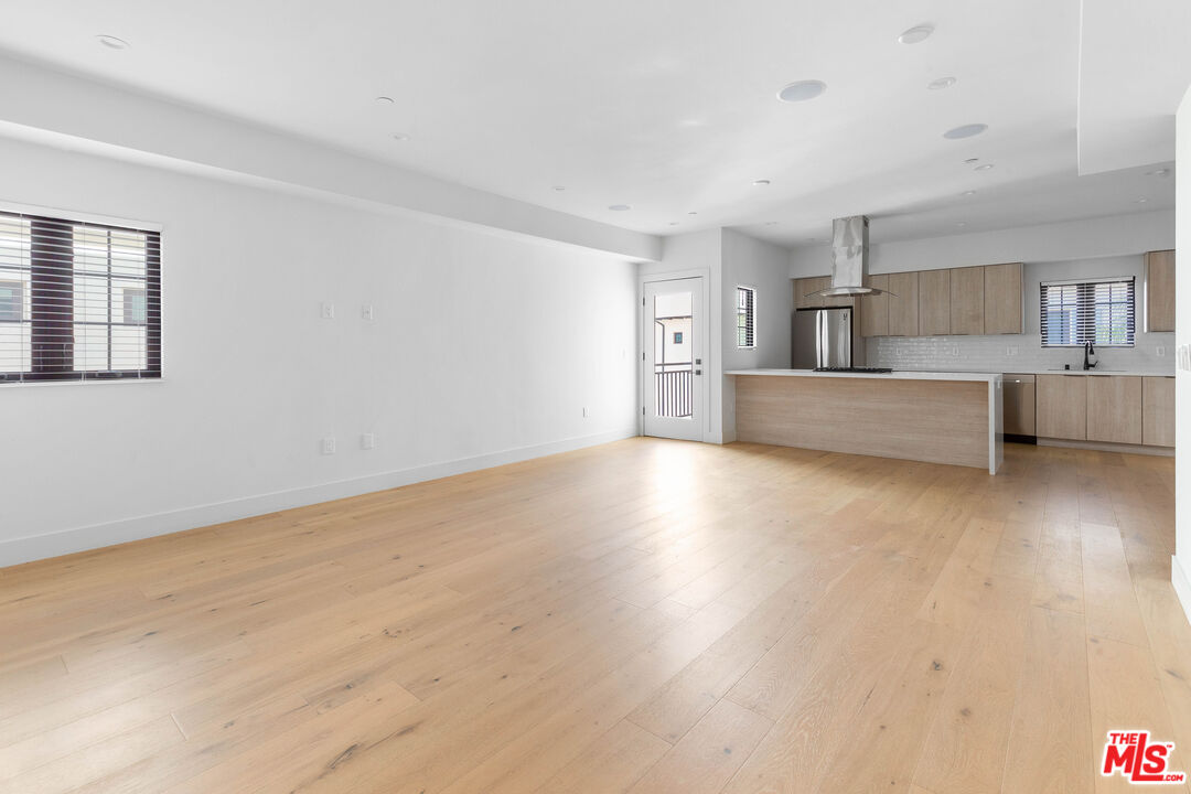 736 Parkman Avenue Los Angeles, CA 90026 - Photo 7 of 34 a view of kitchen with furniture and wooden floor